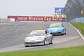 The two Porsches travel the circuit at Watkins Glen. 