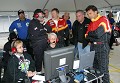 The team watches as Terry Borcheller wins the opening round in the #44 TheRaceSite.com Porsche. 