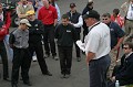 Mark Raufaff leads the Grand American Rolex drivers meeting a Will Nonnamaker, Joe Nonnamaker, and Wayne Nonnamaker listen on. 